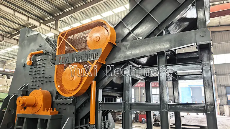the powerful orange gear drive and protected belt transmission system of the Hammer Mill Metal Shredder