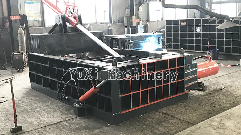 Large capacity metal baler (side view) showcasing robust structural design for metal compaction