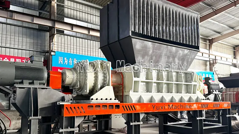 High-capacity twin shaft shredder featuring a ribbed hopper design for processing bulky waste and scrap.